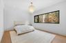 Bedroom with light wood finished floors, recessed lighting, and a chandelier
