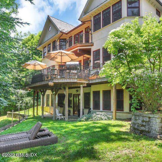 Stately Old World Elegance on 4 levels of quality construction centrally located on rolling grounds adjoining beauty of 100 acres of protected woodlands park.