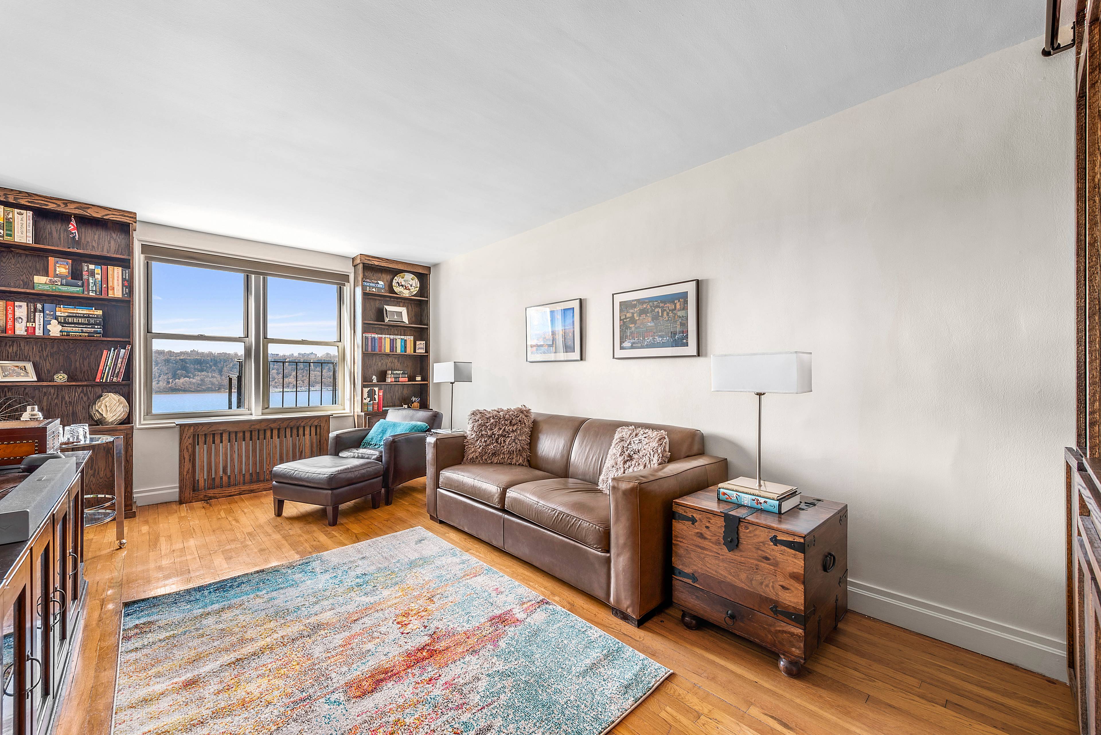 Serene river views and craftsman details define this bright and sunny one bedroom on a cul de sac off West 181st Street.