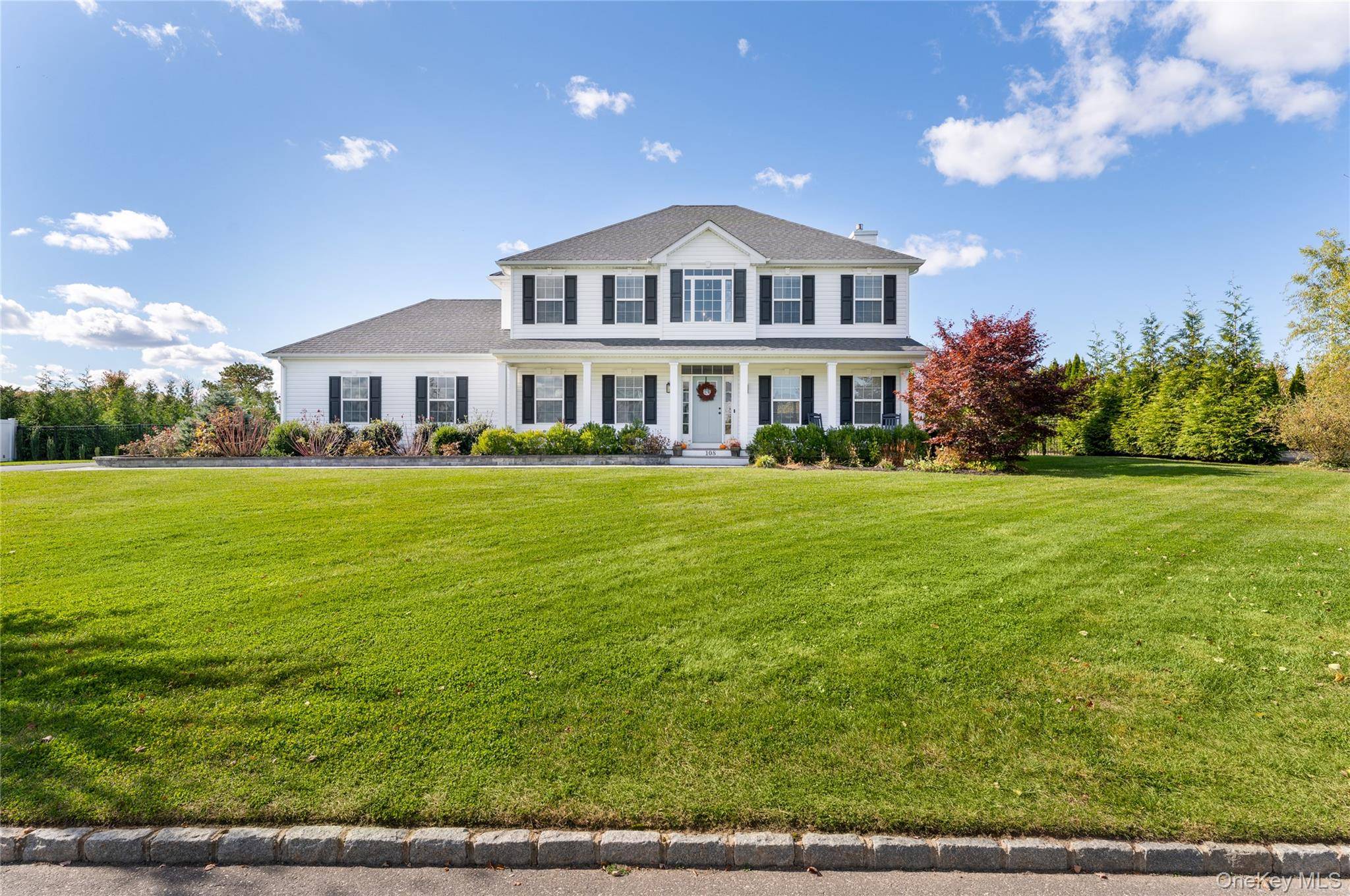 Stunning 2400 sq ft Jamesport model set on a beautifully landscaped.