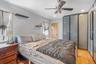 Bedroom featuring light wood-style flooring, a ceiling fan, and recessed lighting