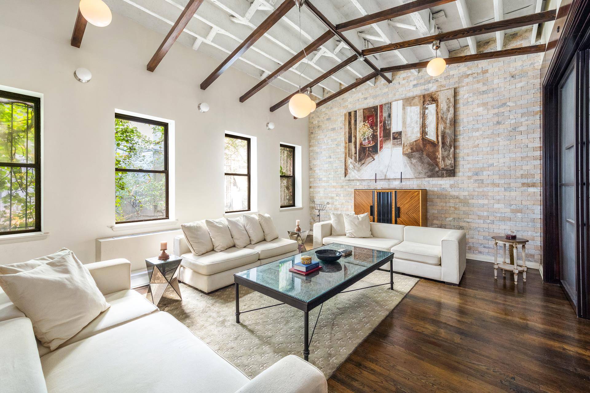 Located on a historic block in the West Village at the crossroads of SoHo, this classic, Prewar duplex offers dramatic scale through its height, width, and depth.