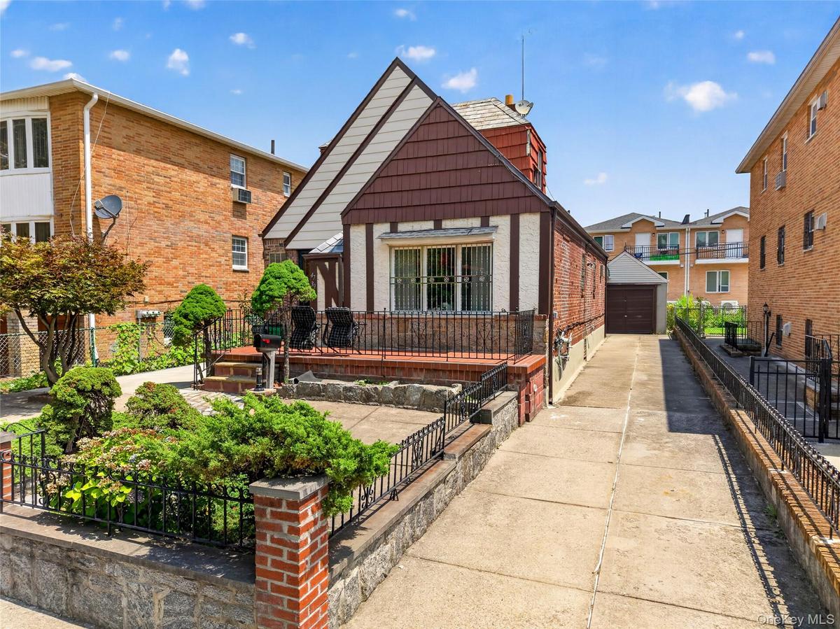 Tudor-style home with brick and stucco siding