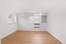 Bright bedroom with luxury vinyl flooring and freshly painted