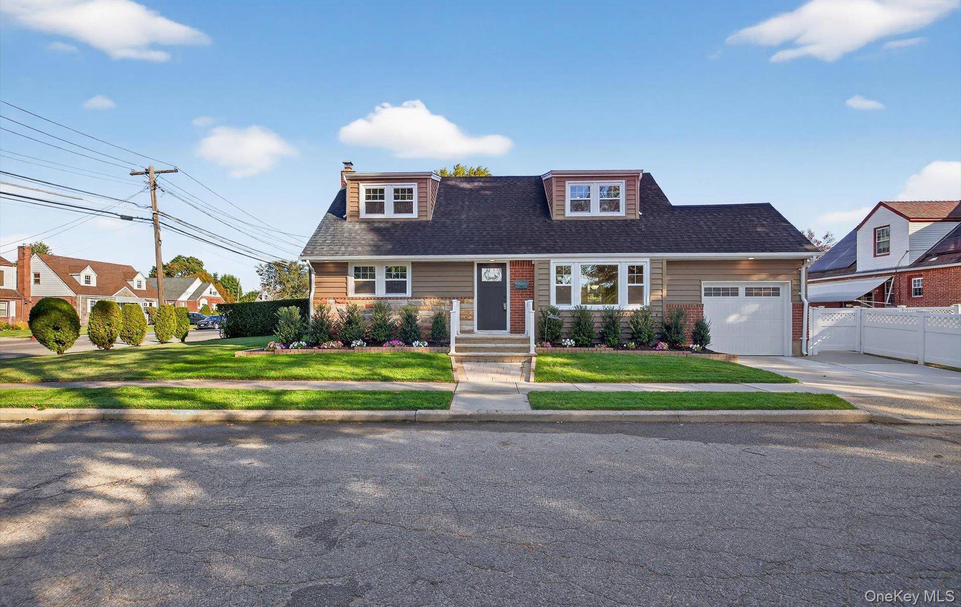 This special Cape Cod home sits proudly on a desirable corner property in the heart of Franklin Square.