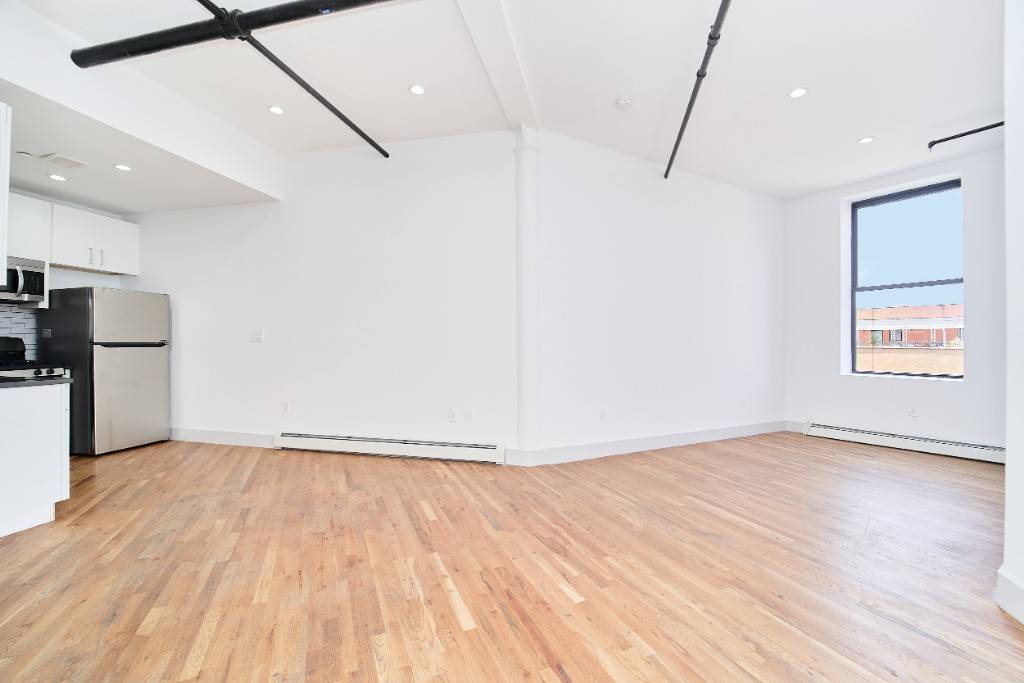 Luxury Rental BushwickAPARTMENT High CeilingsChefs KitchenWasher Dryer In UnitDishwasherOver Sized Living Room Dining AlcoveStrip Wood FlooringNo Broker Fee1381 Myrtle ElevatorLaundry RoomCarson Home SystemHeart of BushwickClose to L and M Trains