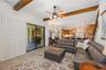 Family Room with wood beamed ceiling accents