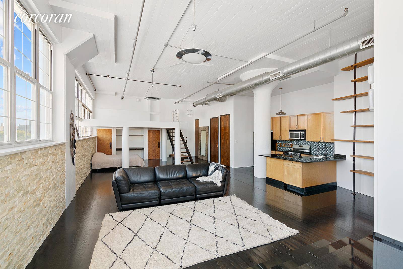 Find yourself enveloped in light and surrounded by sky the moment you step in the door of this dramatic and dynamic true industrial loft condo space.