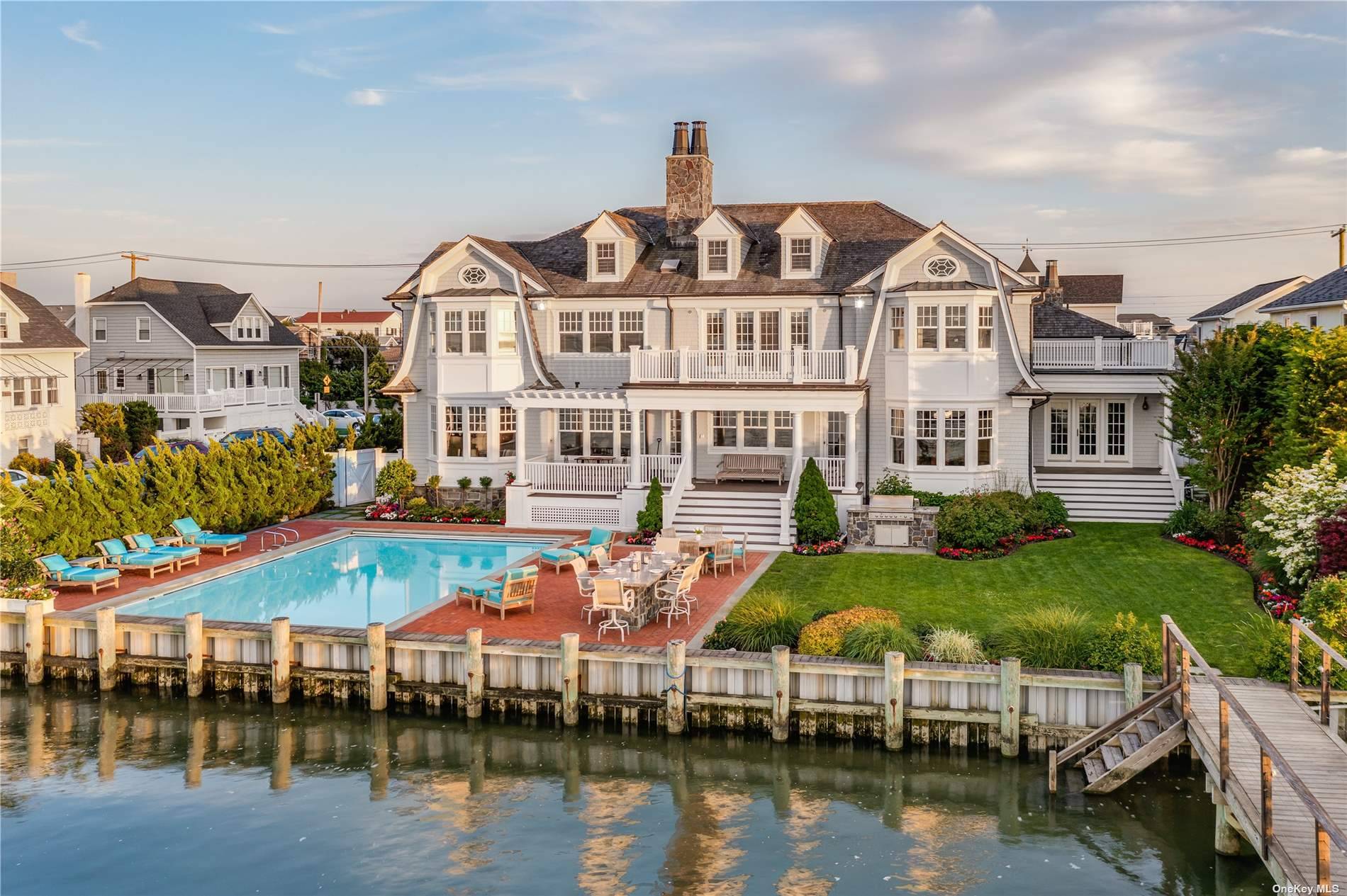 Water Front Property ! This Hamptons style architectural masterpiece offers stunning views of the Manhattan skyline and breathtaking sunsets.