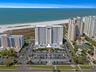 Aerial showing other similar residential properties along the beach