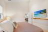 Guest bedroom with TV and ensuite bathroom