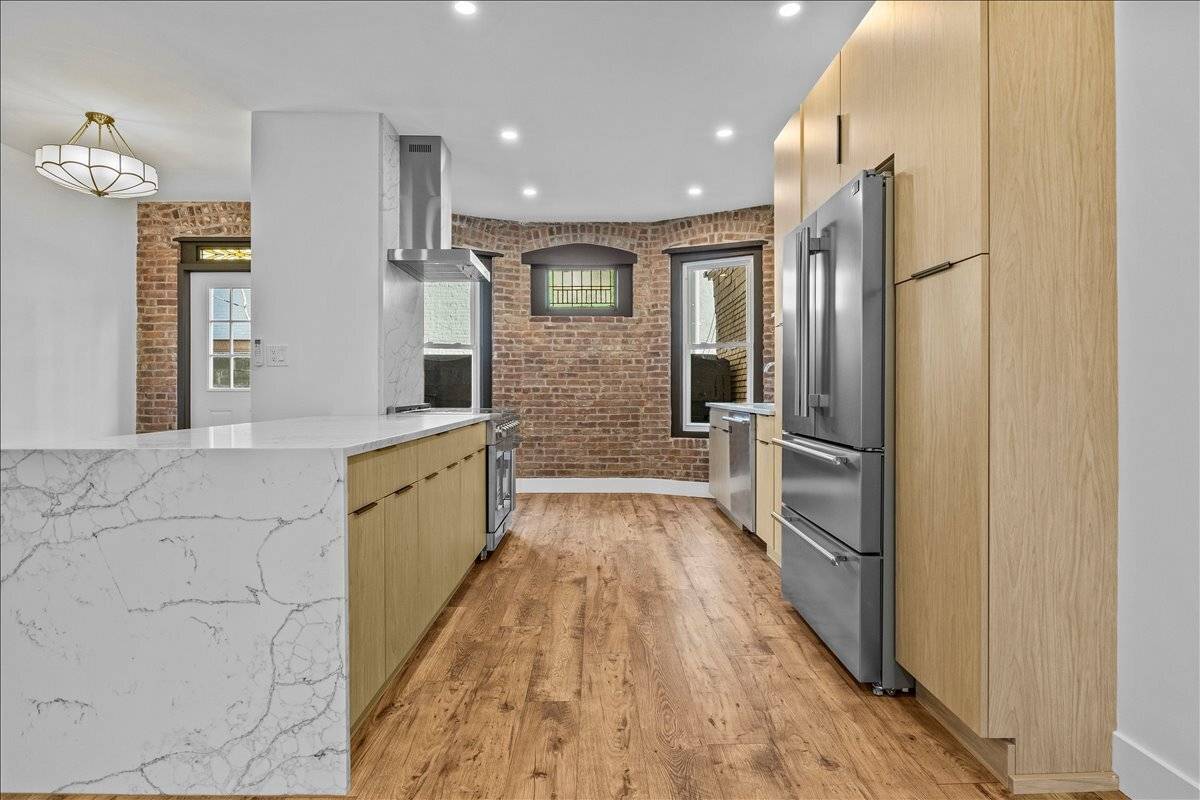 Be the first to live in this turn key three bedroom, two and a half bathroom 20 foot wide brick townhouse featuring timeless designer style, private outdoor space, brand new ...