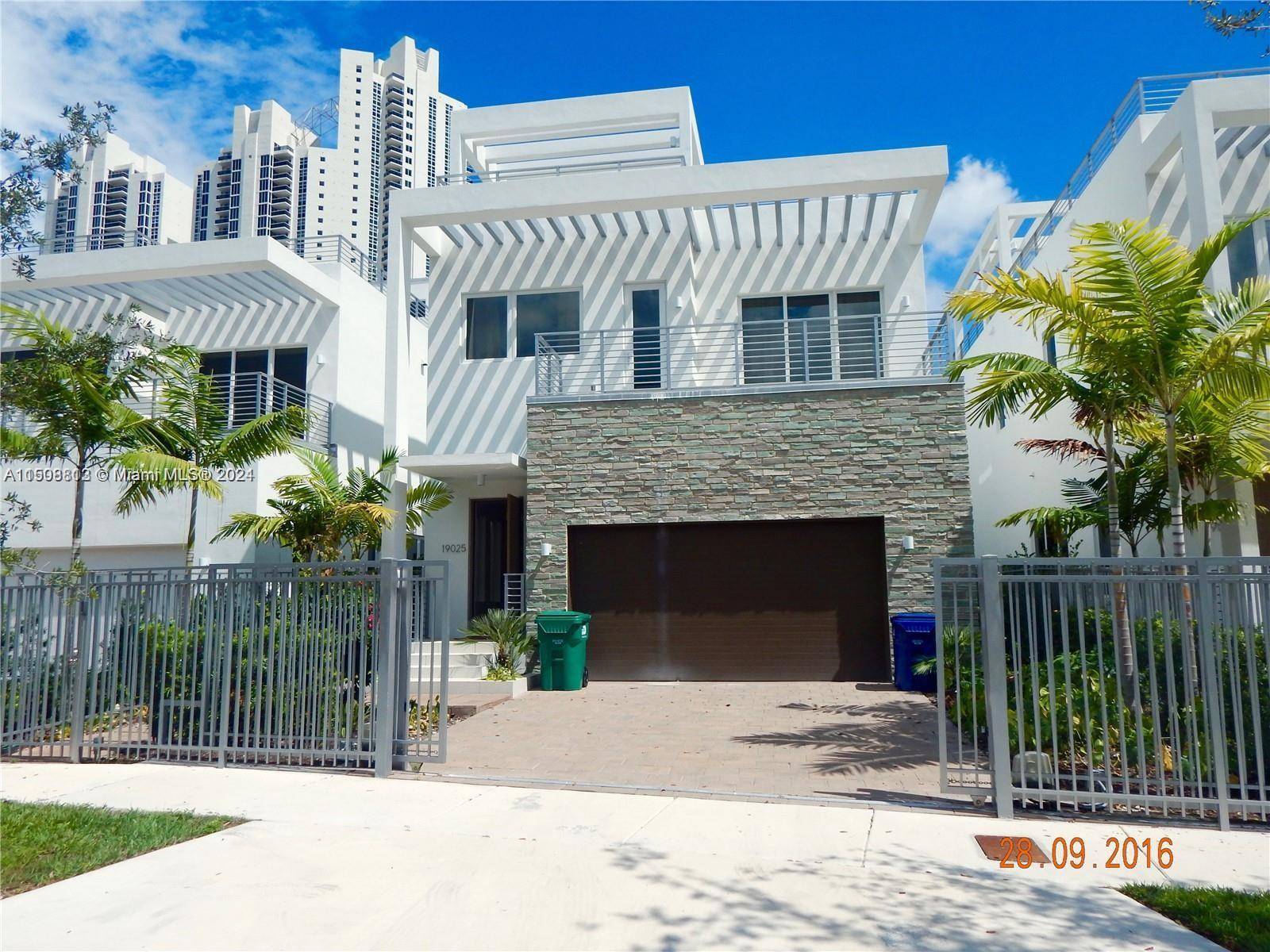 Modern two story pool home in Sunny Isles nestled steps away from the beach and sand.
