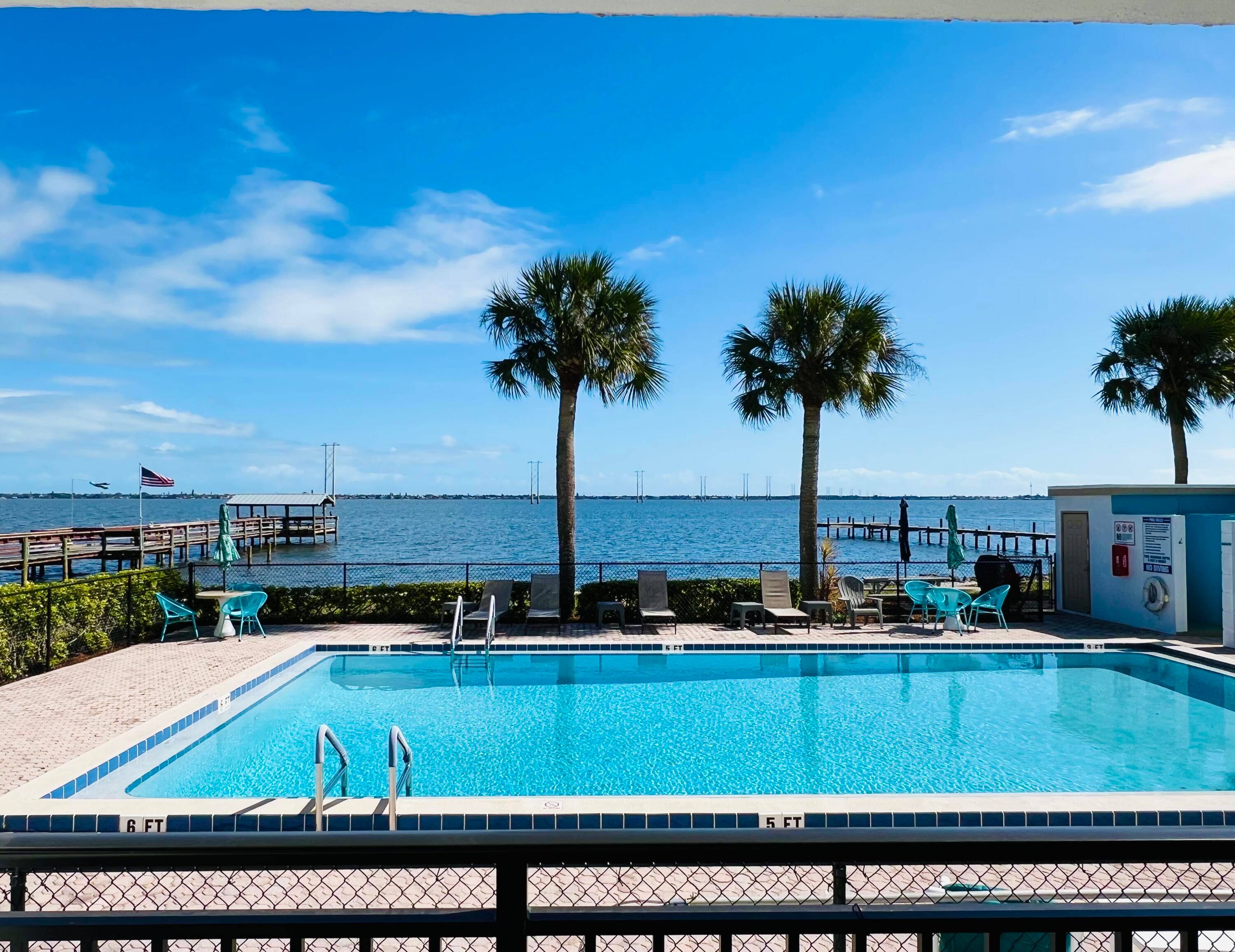 Completely remodeled waterfront condo 2b 2b 1st floor unit with private balcony to an amazing view of the river, swimming pool, dolphins, and rocket launches.