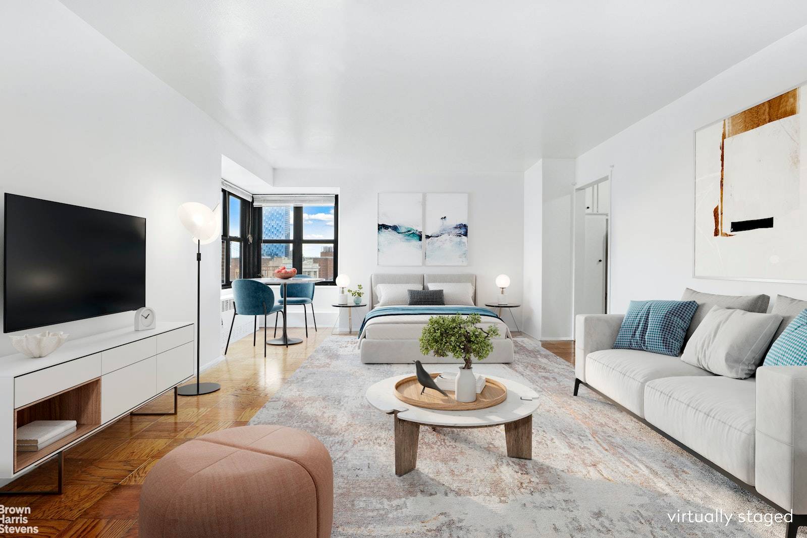 Spacious light filled studio on high floor with five windows and dramatic partial river views including the Manhattan Bridge !