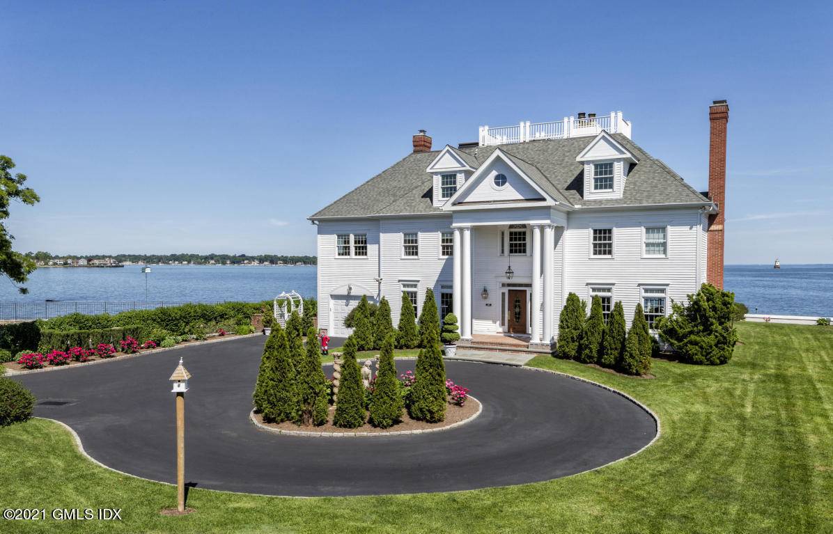 Direct waterfront Grand Georgian Manor renovated with magnificent panoramic views of Long Island Sound.