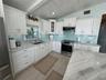 A spacious, bright, and functional kitchen with a view that is unrivaled.