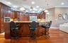 Custom Kitchen: Prep Sink, Snackbar, Custom Cabinets with under and over lighting, Hybrid Induction Cooktop, Hidden walk-in pantry