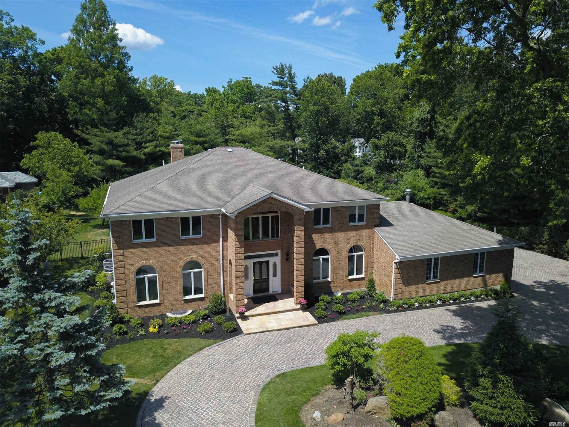 The living is easy in this impressive, generously proportioned colonial residence on park like property, located on prestigious Elderfields Road.