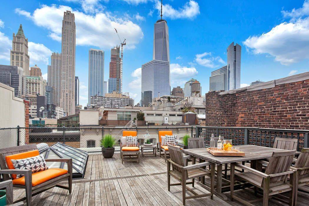 HISTORIC CAST IRON PENTHOUSE IN TRIBECA This extraordinary condominium penthouse offers 5, 075 SF of indoor and outdoor living.