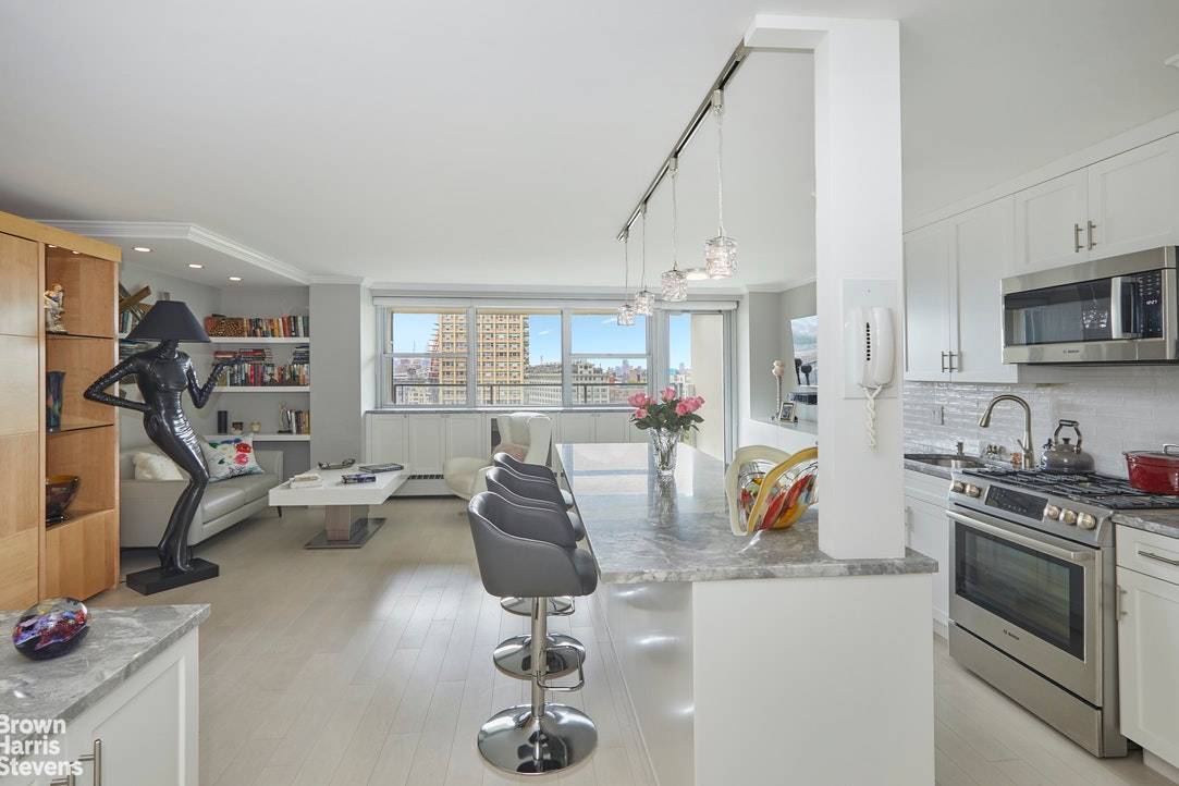 Rare opportunity to purchase a high floor exquisitely designed and renovated TURN KEY READY spacious studio with city, river and bridge views from your own private balcony.