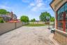 Fenced backyard with a patio area