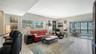 Living room with an extra large sunny window.