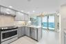 Kitchen Opens to Balcony Dining Area with Gorgeous Views