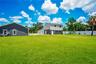 Yard view of Workshop with 2nd story apartment (2/1 with loft and kitchen..storage downstairs)