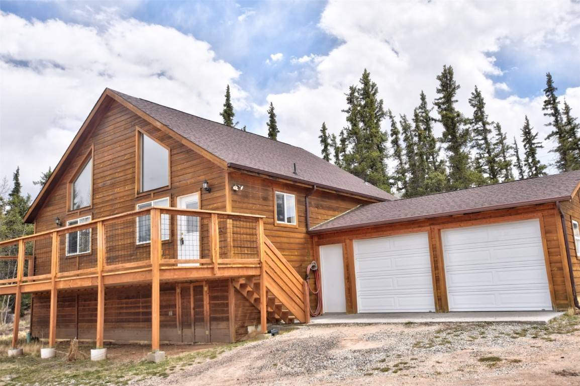 This two bedroom, two bath cabin with an oversized, attached two car garage is bright and open and in the perfect location in Indian Mountain.