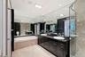 Luxury marble bath with granite counters, double vanity, jetted tub and separate shower.