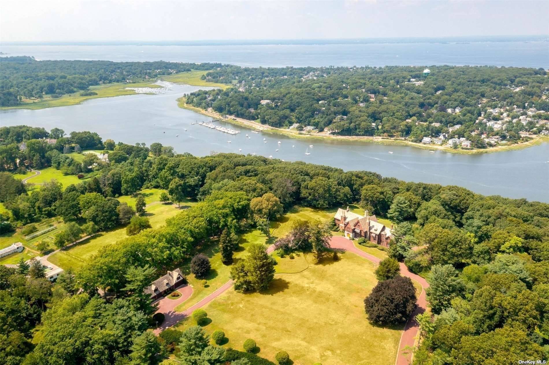 A 12 Acres of Waterfront Land with Multiple Cottages and Pools on Property.