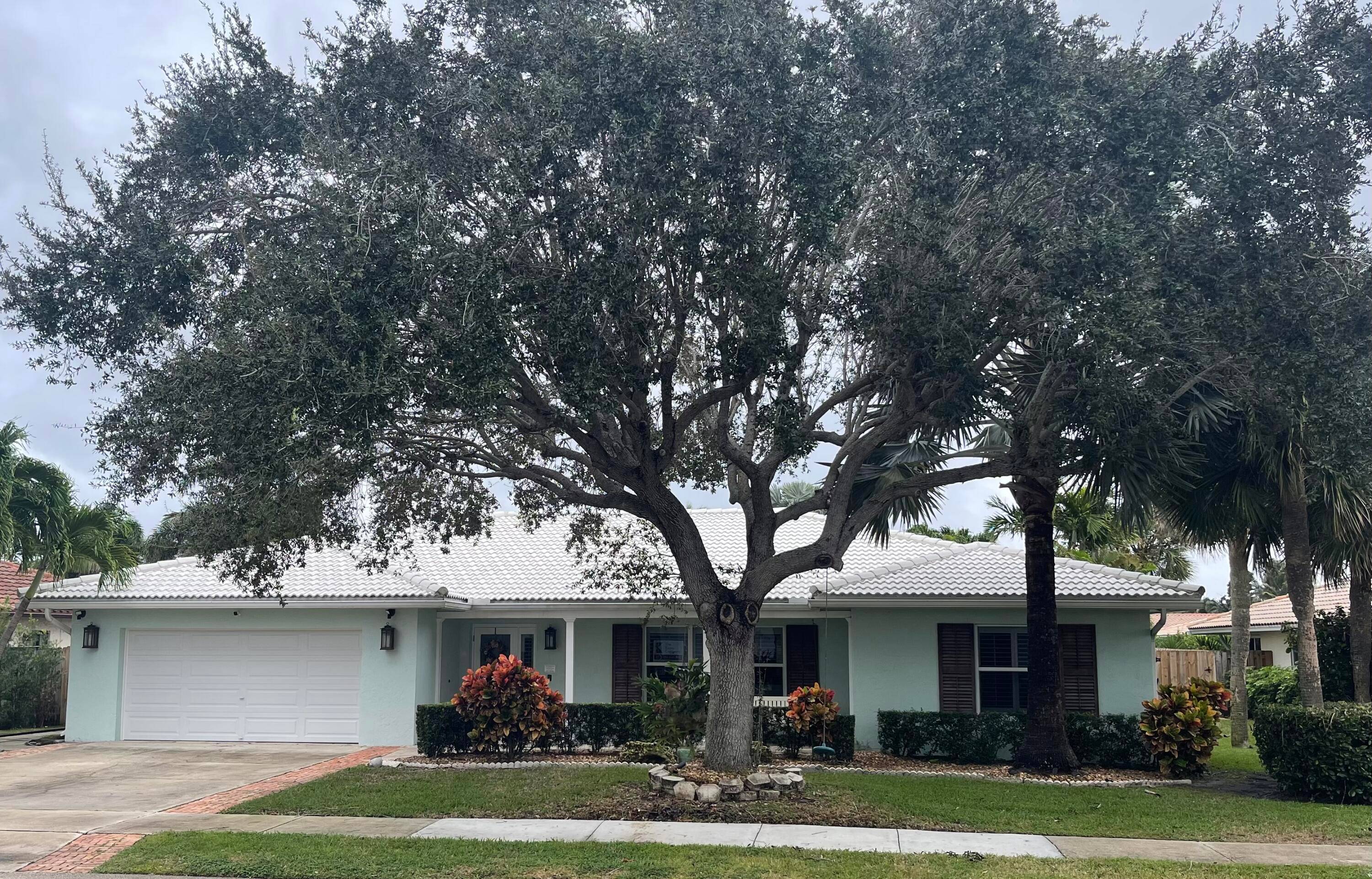 This updated 4BD 3BA pool home is tucked away in the very desirable Carriage Hill neighborhood in East Boca Raton.