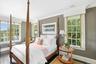 Bedroom with ornamental molding, wood finished floors, and recessed lighting