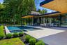 Expansive outdoor terrace with pool, outdoor seating and outdoor kitchen