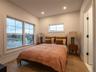 Bedroom featuring wood-type flooring and recessed lighting
