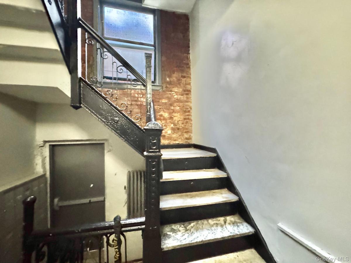Stairway with brick wall