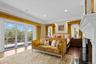 Bedroom with wood finished floors, access to outside, recessed lighting, a fireplace, and ornamental molding