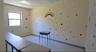 Office featuring a baseboard heating unit and a paneled ceiling