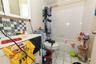 Full bathroom with shower / bathtub combination with curtain, tile patterned flooring, and a baseboard heating unit