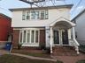 View of front of property with brick siding
