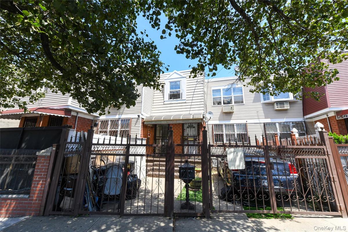 View of front of property with a gate and a fenced front yard
