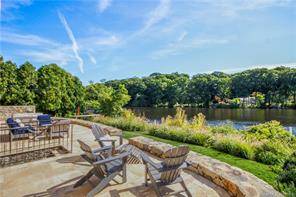 Direct waterfront luxury townhouse with private dock, multi level terraces and 8 person hot tub overlooking the Mianus River.