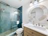 The newly remodeled bathroom has a walk-in shower.