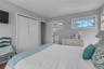 Bedroom featuring a closet and wood finished floors