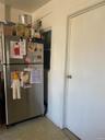 Kitchen featuring freestanding refrigerator