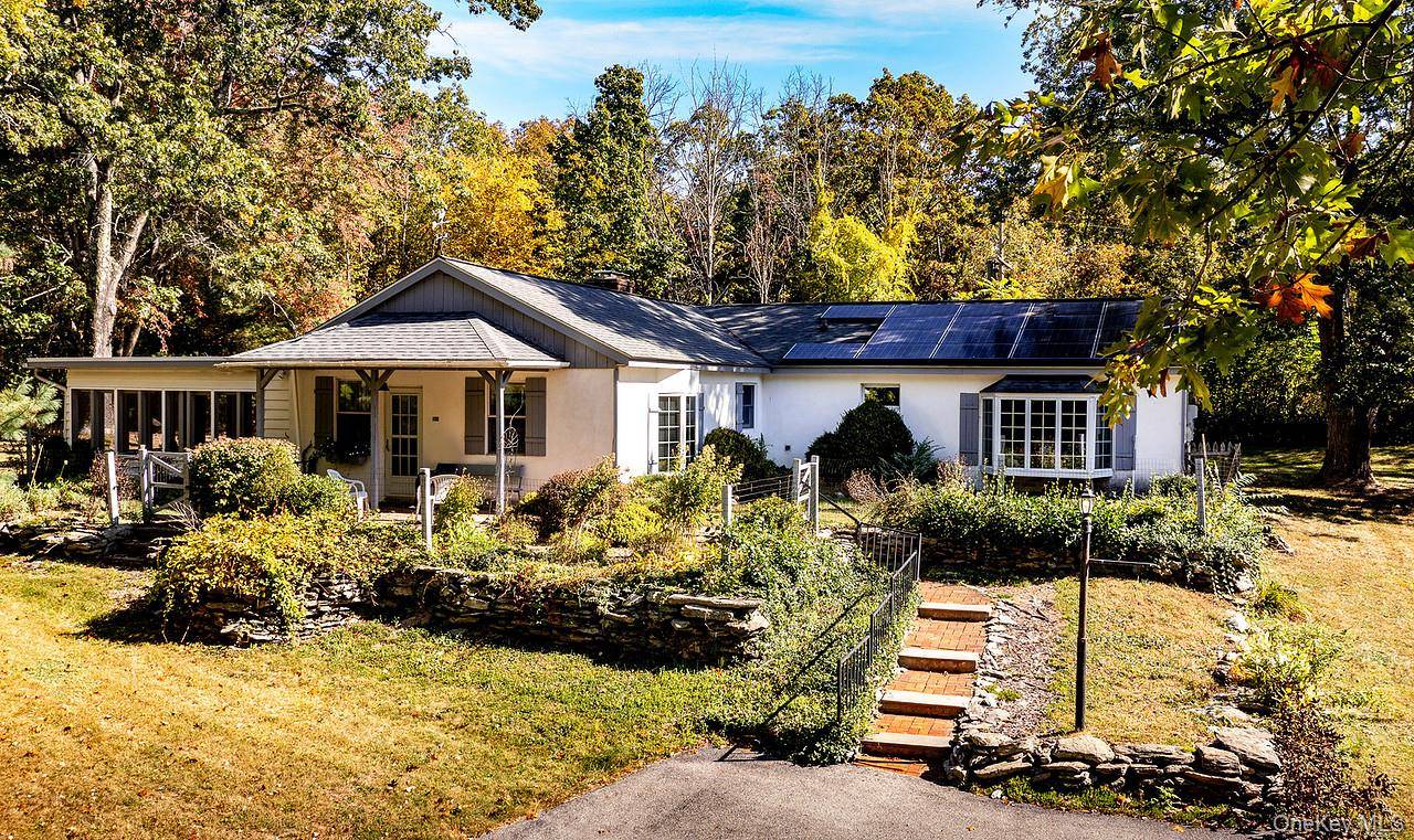 Nestled at the top of a meandering driveway, this charming four bedroom ranch offers privacy, and scenic views in an ideal location.