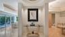 Dramatic entry to the primary suite creates an immediate sense of elegance and style