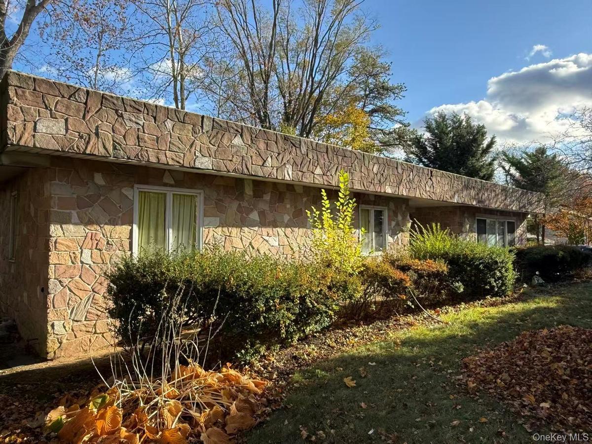 View of home's exterior with stone siding