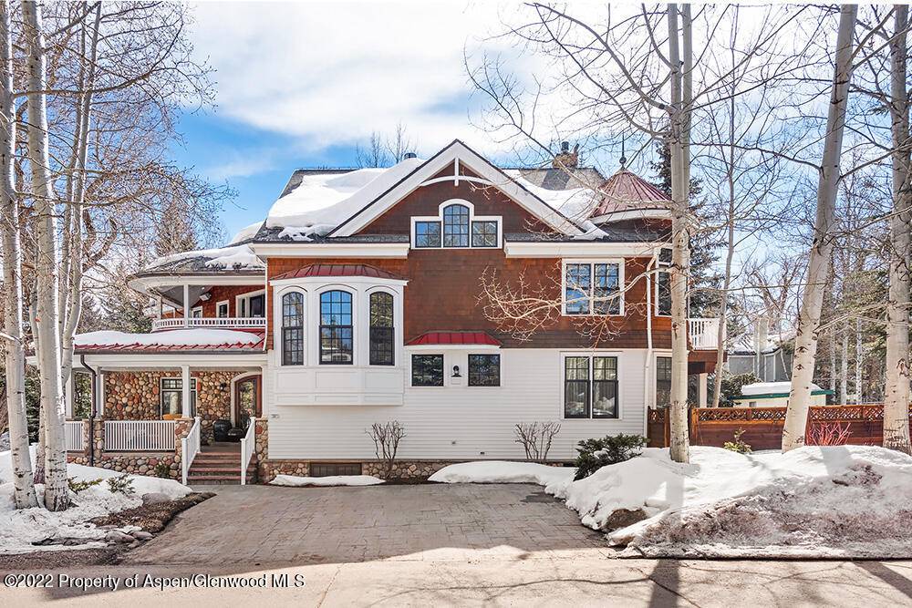 This impeccably maintained five bedroom home is located on a large corner lot in Aspen's coveted West End.
